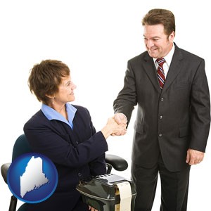 a court reporter shaking hands with an attorney - with Maine icon