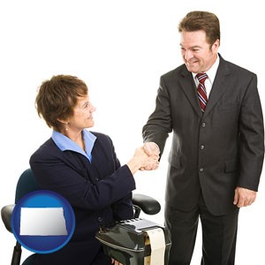 a court reporter shaking hands with an attorney - with North Dakota icon