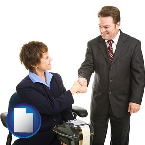 a court reporter shaking hands with an attorney - with Utah icon