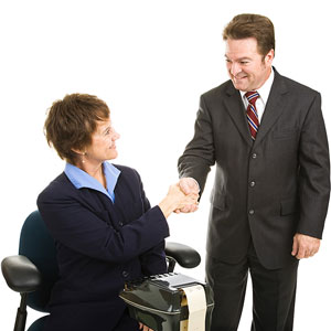 a court reporter shaking hands with an attorney